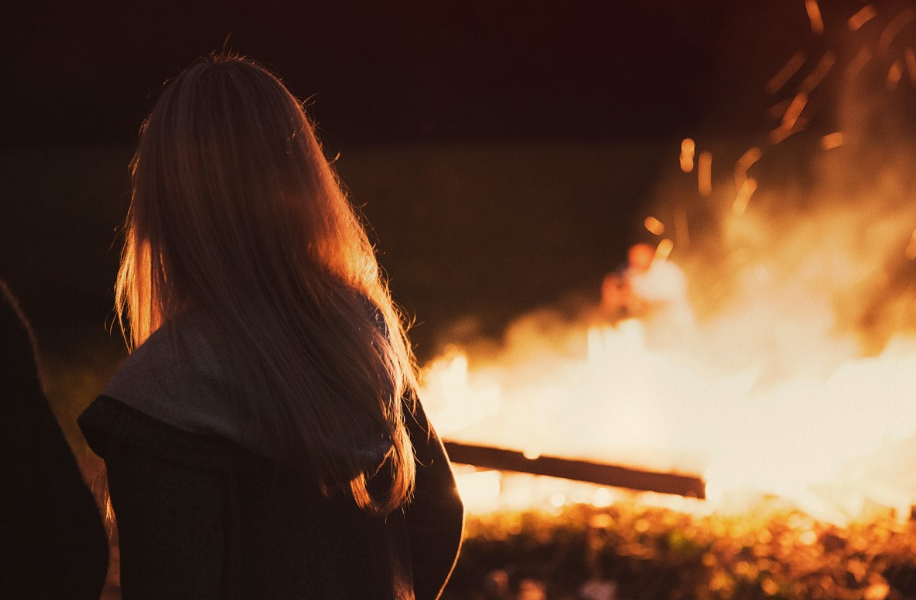 A girl's watching the fire