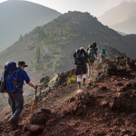 People backpacking on a mountain